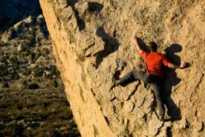 Solve Creatively - Rock Climber on face of difficult climb